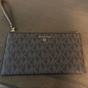 Michael Kors Brown and tan Logo Wristlet Pouch- Brand new. Never used
